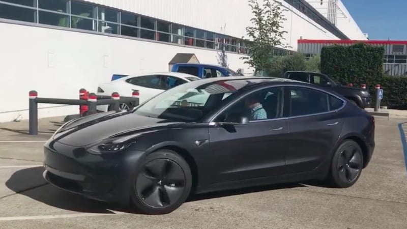 Get a closer look at the Tesla Model 3 as it drives away